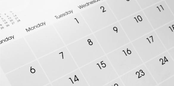 A close up of a calendar showing days and dates.